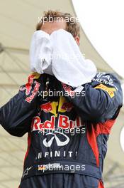 Sebastian Vettel (GER) Red Bull Racing on the grid. Motor Racing - Formula One World Championship - Bahrain Grand Prix - Race Day - Sakhir, Bahrain