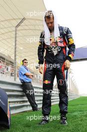 Sebastian Vettel (GER) Red Bull Racing on the grid. Motor Racing - Formula One World Championship - Bahrain Grand Prix - Race Day - Sakhir, Bahrain