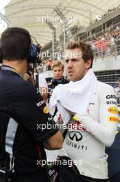 Sebastian Vettel (GER) Red Bull Racing on the grid. Motor Racing - Formula One World Championship - Bahrain Grand Prix - Race Day - Sakhir, Bahrain