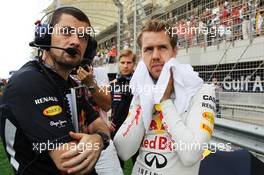 Sebastian Vettel (GER) Red Bull Racing on the grid. Motor Racing - Formula One World Championship - Bahrain Grand Prix - Race Day - Sakhir, Bahrain