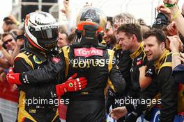 Lotus Renault GP Kimi Raikkonen (FIN) Lotus F1 Team and Romain Grosjean (FRA) Lotus F1 Team celebrate in parc ferme. Motor Racing - Formula One World Championship - Bahrain Grand Prix - Race Day - Sakhir, Bahrain