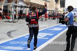 Race winner Sebastian Vettel (GER) Red Bull Racing runs to parc ferme as he stopped at the end of the race. Motor Racing - Formula One World Championship - Bahrain Grand Prix - Race Day - Sakhir, Bahrain