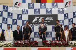 podium and results, 2nd place Kimi Raikkonen, Lotus Renault F1 Team with 1st place Sebastian Vettel (GER), Red Bull Racing and 3rd place Romain Grosjean (FRA), Lotus Renault F1 Team with  22.04.2012. Formula 1 World Championship, Rd 4, Bahrain Grand Prix, Sakhir, Bahrain, Race Day