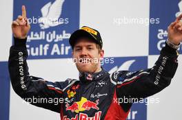 Race winner Sebastian Vettel (GER) Red Bull Racing celebrates on the podium. Motor Racing - Formula One World Championship - Bahrain Grand Prix - Race Day - Sakhir, Bahrain