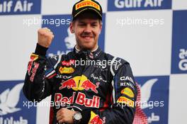 Race winner Sebastian Vettel (GER) Red Bull Racing celebrates on the podium. Motor Racing - Formula One World Championship - Bahrain Grand Prix - Race Day - Sakhir, Bahrain