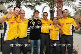 Romain Grosjean (FRA) Lotus F1 Team celebrates his third position with the team. Motor Racing - Formula One World Championship - Bahrain Grand Prix - Race Day - Sakhir, Bahrain
