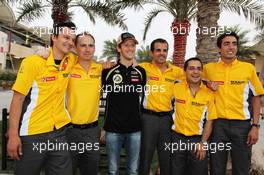Romain Grosjean (FRA) Lotus F1 Team celebrates his third position with the team. Motor Racing - Formula One World Championship - Bahrain Grand Prix - Race Day - Sakhir, Bahrain