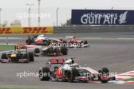 Lewis Hamilton (GBR) McLaren MP4/27 leads Mark Webber (AUS) Red Bull Racing RB8. Motor Racing - Formula One World Championship - Bahrain Grand Prix - Race Day - Sakhir, Bahrain