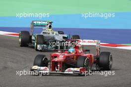 Fernando Alonso (ESP) Ferrari F2012 leads Nico Rosberg (GER) Mercedes AMG F1 W03. Motor Racing - Formula One World Championship - Bahrain Grand Prix - Race Day - Sakhir, Bahrain