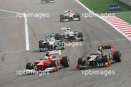 (L to R): Felipe Massa (BRA) Ferrari F2012 and Kimi Raikkonen (FIN) Lotus E20 battle for position. Motor Racing - Formula One World Championship - Bahrain Grand Prix - Race Day - Sakhir, Bahrain