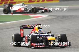 Sebastian Vettel (GER) Red Bull Racing RB8 leads Lewis Hamilton (GBR) McLaren MP4/27. Motor Racing - Formula One World Championship - Bahrain Grand Prix - Race Day - Sakhir, Bahrain