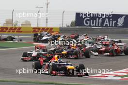 Sebastian Vettel (GER) Red Bull Racing RB8 leads at the start of the race. Motor Racing - Formula One World Championship - Bahrain Grand Prix - Race Day - Sakhir, Bahrain