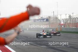 Paul di Resta (GBR) Sahara Force India VJM05 finishes sixth ahead of Fernando Alonso (ESP) Ferrari F2012 and celebrates past his team at the end of the race. Motor Racing - Formula One World Championship - Bahrain Grand Prix - Race Day - Sakhir, Bahrain