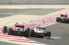Daniel Ricciardo (AUS) Scuderia Toro Rosso STR7 and Pastor Maldonado (VEN) Williams FW34. Motor Racing - Formula One World Championship - Bahrain Grand Prix - Race Day - Sakhir, Bahrain