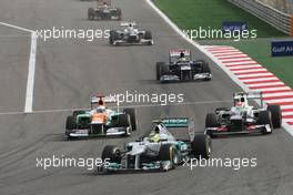 Nico Rosberg (GER) Mercedes AMG F1 W03 leads Nico Hulkenberg (GER) Sahara Force India F1 VJM05 and Sergio Perez (MEX) Sauber C31. Motor Racing - Formula One World Championship - Bahrain Grand Prix - Race Day - Sakhir, Bahrain
