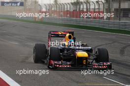 Race winner Sebastian Vettel (GER) Red Bull Racing RB8 celebrates past his team at the end of the race. Motor Racing - Formula One World Championship - Bahrain Grand Prix - Race Day - Sakhir, Bahrain