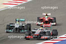 Lewis Hamilton (GBR) McLaren MP4/27 leads Nico Rosberg (GER) Mercedes AMG F1 W03 and Felipe Massa (BRA) Ferrari F2012. Motor Racing - Formula One World Championship - Bahrain Grand Prix - Race Day - Sakhir, Bahrain