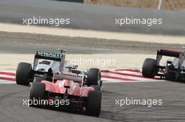 Nico Rosberg (GER) Mercedes AMG F1 W03 leads Felipe Massa (BRA) Ferrari F2012. Motor Racing - Formula One World Championship - Bahrain Grand Prix - Race Day - Sakhir, Bahrain