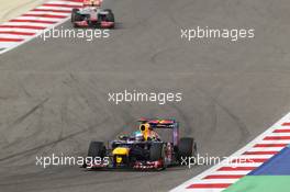 Sebastian Vettel (GER) Red Bull Racing RB8 leads Lewis Hamilton (GBR) McLaren MP4/27. Motor Racing - Formula One World Championship - Bahrain Grand Prix - Race Day - Sakhir, Bahrain