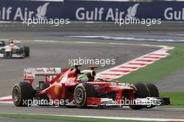 (L to R): Felipe Massa (BRA) Ferrari F2012 and Kimi Raikkonen (FIN) Lotus E20 battle for position. Motor Racing - Formula One World Championship - Bahrain Grand Prix - Race Day - Sakhir, Bahrain