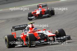 Charles Pic (FRA), Marussia F1 Team leads Timo Glock (GER), Marussia F1 Team  22.04.2012. Formula 1 World Championship, Rd 4, Bahrain Grand Prix, Sakhir, Bahrain, Race Day