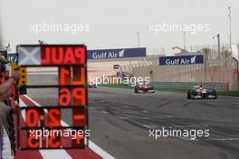 Paul di Resta (GBR) Sahara Force India VJM05 holds sixth place on the final lap ahead of Fernando Alonso (ESP) Ferrari F2012. Motor Racing - Formula One World Championship - Bahrain Grand Prix - Race Day - Sakhir, Bahrain