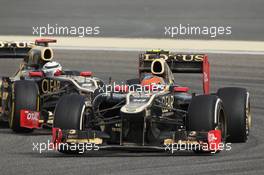 Romain Grosjean (FRA) Lotus F1 E20 leads Kimi Raikkonen (FIN) Lotus E20. Motor Racing - Formula One World Championship - Bahrain Grand Prix - Race Day - Sakhir, Bahrain