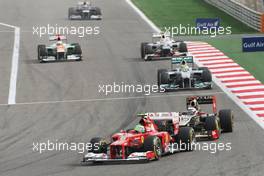 Felipe Massa (BRA) Ferrari F2012 leads Kimi Raikkonen (FIN) Lotus E20. Motor Racing - Formula One World Championship - Bahrain Grand Prix - Race Day - Sakhir, Bahrain