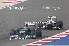 Bruno Senna (BRA) Williams FW34 leads Kamui Kobayashi (JPN) Sauber C31. Motor Racing - Formula One World Championship - Bahrain Grand Prix - Race Day - Sakhir, Bahrain