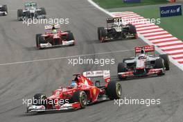 Fernando Alonso (ESP) Ferrari F2012 leads Jenson Button (GBR) McLaren MP4/27. Motor Racing - Formula One World Championship - Bahrain Grand Prix - Race Day - Sakhir, Bahrain