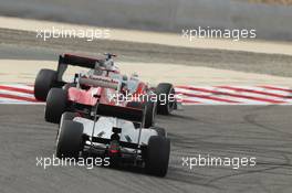 Jenson Button (GBR) McLaren MP4/27 leads Fernando Alonso (ESP) Ferrari F2012 and Lewis Hamilton (GBR) McLaren MP4/27. Motor Racing - Formula One World Championship - Bahrain Grand Prix - Race Day - Sakhir, Bahrain