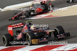 Jean-Eric Vergne (FRA), Scuderia Toro Rosso leads Lewis Hamilton (GBR), McLaren Mercedes  22.04.2012. Formula 1 World Championship, Rd 4, Bahrain Grand Prix, Sakhir, Bahrain, Race Day