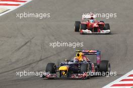 Mark Webber (AUS) Red Bull Racing RB8 leads Fernando Alonso (ESP) Ferrari F2012. Motor Racing - Formula One World Championship - Bahrain Grand Prix - Race Day - Sakhir, Bahrain