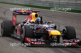 Race winner Sebastian Vettel (GER) Red Bull Racing RB8 celebrates past his team at the end of the race. Motor Racing - Formula One World Championship - Bahrain Grand Prix - Race Day - Sakhir, Bahrain