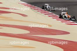 Nico Hulkenberg (GER) Sahara Force India F1 VJM05 leads Kamui Kobayashi (JPN) Sauber C31. Motor Racing - Formula One World Championship - Bahrain Grand Prix - Race Day - Sakhir, Bahrain