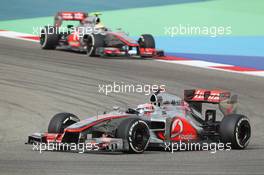 Jenson Button (GBR) McLaren MP4/27 leads team mate Lewis Hamilton (GBR) McLaren MP4/27. Motor Racing - Formula One World Championship - Bahrain Grand Prix - Race Day - Sakhir, Bahrain