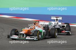 Nico Hulkenberg (GER) Sahara Force India F1 VJM05 leads Kamui Kobayashi (JPN) Sauber C31. Motor Racing - Formula One World Championship - Bahrain Grand Prix - Race Day - Sakhir, Bahrain