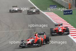 Charles Pic (FRA) Marussia F1 Team MR01 leads team mate Timo Glock (GER) Marussia F1 Team MR01. Motor Racing - Formula One World Championship - Bahrain Grand Prix - Race Day - Sakhir, Bahrain