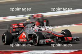 Jenson Button (GBR), McLaren Mercedes leads Lewis Hamilton (GBR), McLaren Mercedes  22.04.2012. Formula 1 World Championship, Rd 4, Bahrain Grand Prix, Sakhir, Bahrain, Race Day