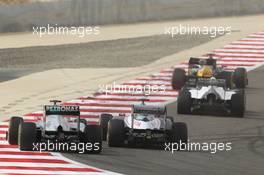 Michael Schumacher (GER) Mercedes AMG F1 W03 and Pastor Maldonado (VEN) Williams FW34. Motor Racing - Formula One World Championship - Bahrain Grand Prix - Race Day - Sakhir, Bahrain