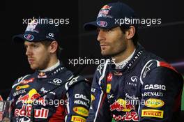 (L to R): Sebastian Vettel (GER) Red Bull Racing and team mate Mark Webber (AUS) Red Bull Racing in the FIA Press Conference. 21.04.2012. Formula 1 World Championship, Rd 4, Bahrain Grand Prix, Sakhir, Bahrain, Qualifying Day