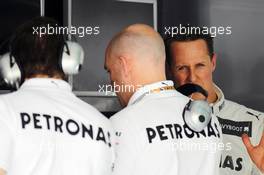 Michael Schumacher (GER) Mercedes AMG F1 (Right) and Jock Clear (GBR) Mercedes AMG F1 (Centre). 21.04.2012. Formula 1 World Championship, Rd 4, Bahrain Grand Prix, Sakhir, Bahrain, Qualifying Day
