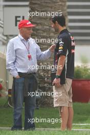 (L to R): Niki Lauda (AUT) with Mark Webber (AUS) Red Bull Racing. 21.04.2012. Formula 1 World Championship, Rd 4, Bahrain Grand Prix, Sakhir, Bahrain, Qualifying Day