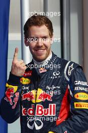 Sebastian Vettel (GER) Red Bull Racing celebrates his pole position in parc ferme. 21.04.2012. Formula 1 World Championship, Rd 4, Bahrain Grand Prix, Sakhir, Bahrain, Qualifying Day