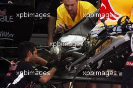 Red Bull Racing RB8 worked on by mechanics. 21.04.2012. Formula 1 World Championship, Rd 4, Bahrain Grand Prix, Sakhir, Bahrain, Qualifying Day