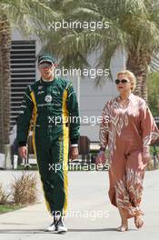 (L to R): Vitaly Petrov (RUS) Caterham with Oksana Kosachenko (RUS) Manager. 21.04.2012. Formula 1 World Championship, Rd 4, Bahrain Grand Prix, Sakhir, Bahrain, Qualifying Day