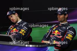 (L to R): Sebastian Vettel (GER) Red Bull Racing and Mark Webber (AUS) Red Bull Racing in the FIA Press Conference. 21.04.2012. Formula 1 World Championship, Rd 4, Bahrain Grand Prix, Sakhir, Bahrain, Qualifying Day