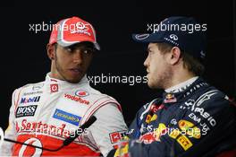 (L to R): Lewis Hamilton (GBR) McLaren with Sebastian Vettel (GER) Red Bull Racing in the FIA Press Conference. 21.04.2012. Formula 1 World Championship, Rd 4, Bahrain Grand Prix, Sakhir, Bahrain, Qualifying Day
