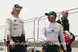 (L to R): Kimi Raikkonen (FIN) Lotus F1 Team with Heikki Kovalainen (FIN) Caterham. 21.04.2012. Formula 1 World Championship, Rd 4, Bahrain Grand Prix, Sakhir, Bahrain, Qualifying Day