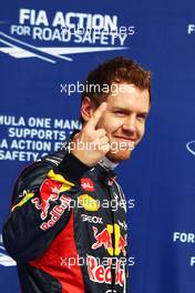 Sebastian Vettel (GER) Red Bull Racing celebrates his pole position in parc ferme. 21.04.2012. Formula 1 World Championship, Rd 4, Bahrain Grand Prix, Sakhir, Bahrain, Qualifying Day